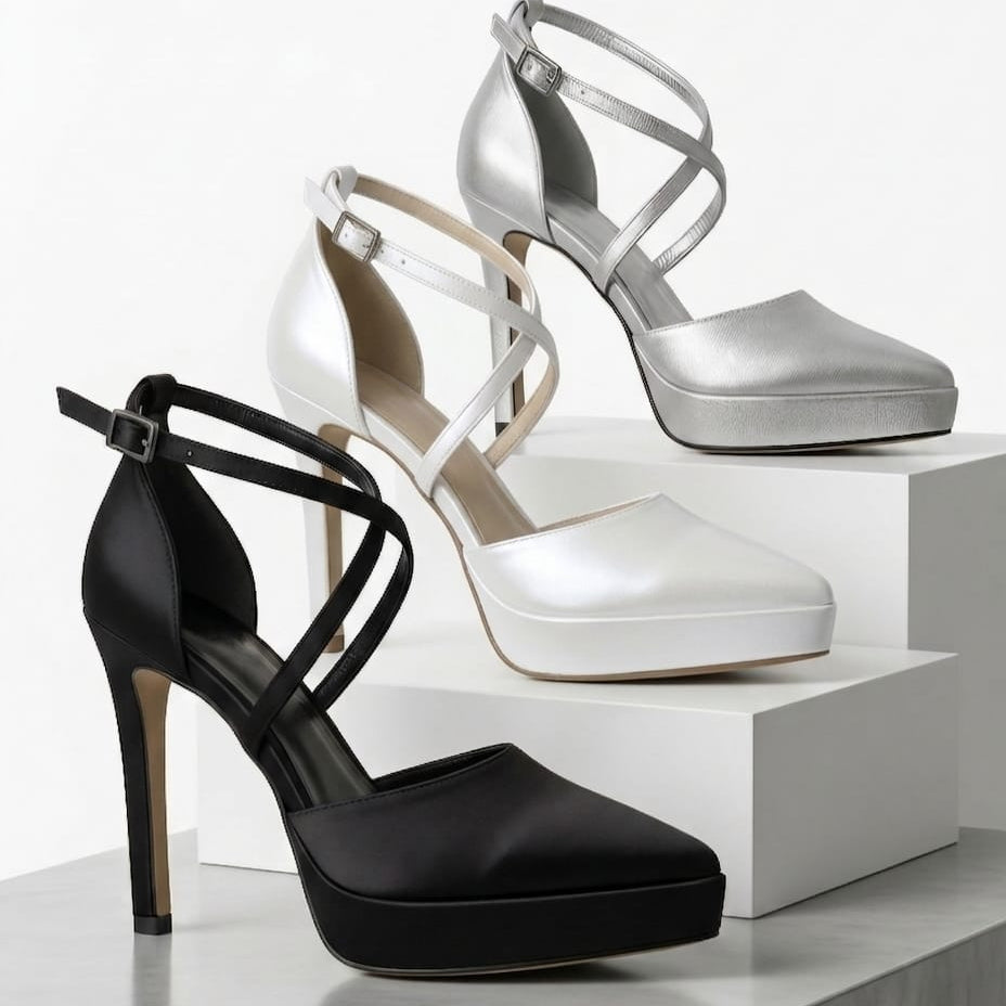 Black, silver, and white high-heeled platform shoes on a white background