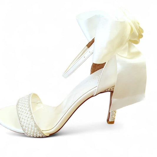 Pearl bow bridal wedding heels sandals in pearl white color for brides and bridesmaids in Beirut Lebanon from White Lily Brides – timeless satin bow design, perfect for weddings, engagements, graduations, and special occasions, available for delivery all over Lebanon.