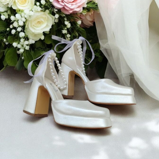 Pearl white bridal heels with comfy 9–10 cm block heel and ankle pearls, perfect for weddings, bridesmaids, graduations, and baptisms – by White Lily Brides, Beirut Lebanon