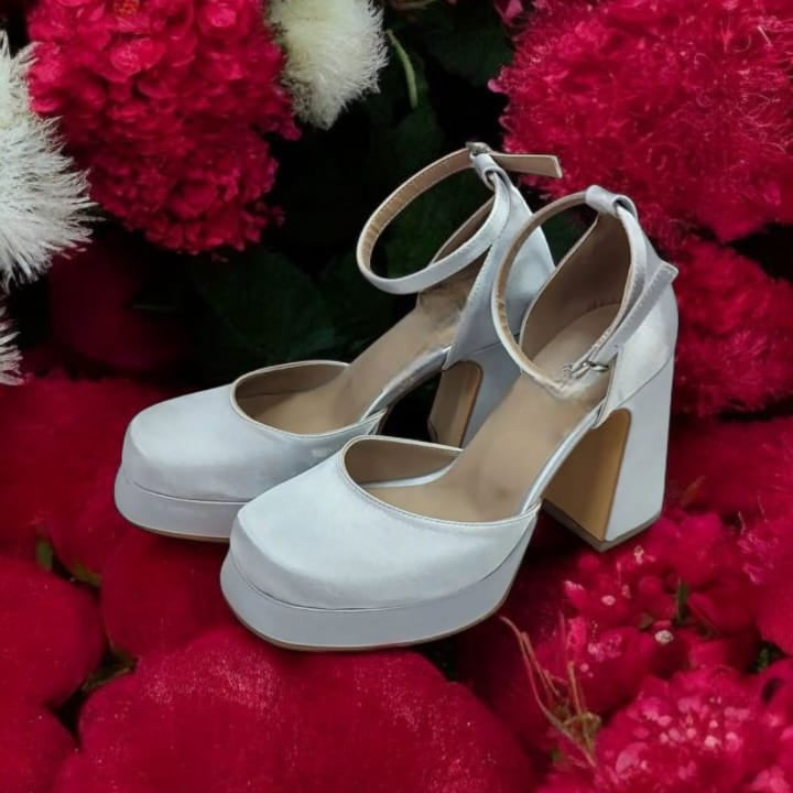 Silver Satin platform wedding heels. Designed for comfort and sophistication, these heels feature a sturdy block heel, a secure ankle strap, and premium-quality material for a luxurious feel. Perfect for brides, bridesmaids, promos graduations and special occasions, these shoes combine timeless beauty with all-day comfort. Beirut Lebanon