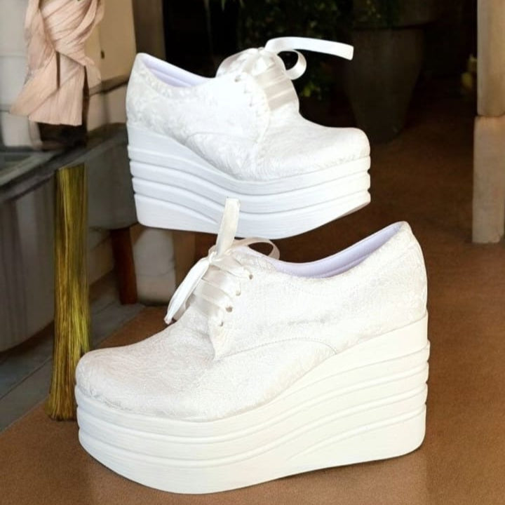 Wedding Sneakers, designed for the modern bride who wants to shine without sacrificing comfort. Featuring a 9cm rock platform, these white lace sneakers add the perfect touch of height while ensuring stability and ease throughout your special day.
