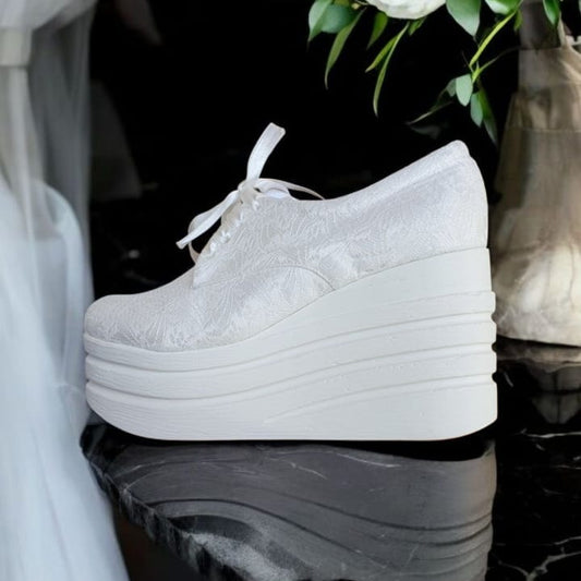 Wedding Sneakers, designed for the modern bride who wants to shine without sacrificing comfort. Featuring a 9cm rock platform, these white lace sneakers add the perfect touch of height while ensuring stability and ease throughout your special day. Beirut Lebanon