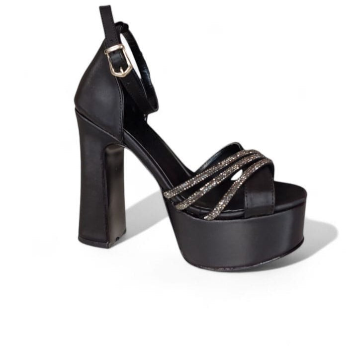 Black platform high heel shoe on a white background