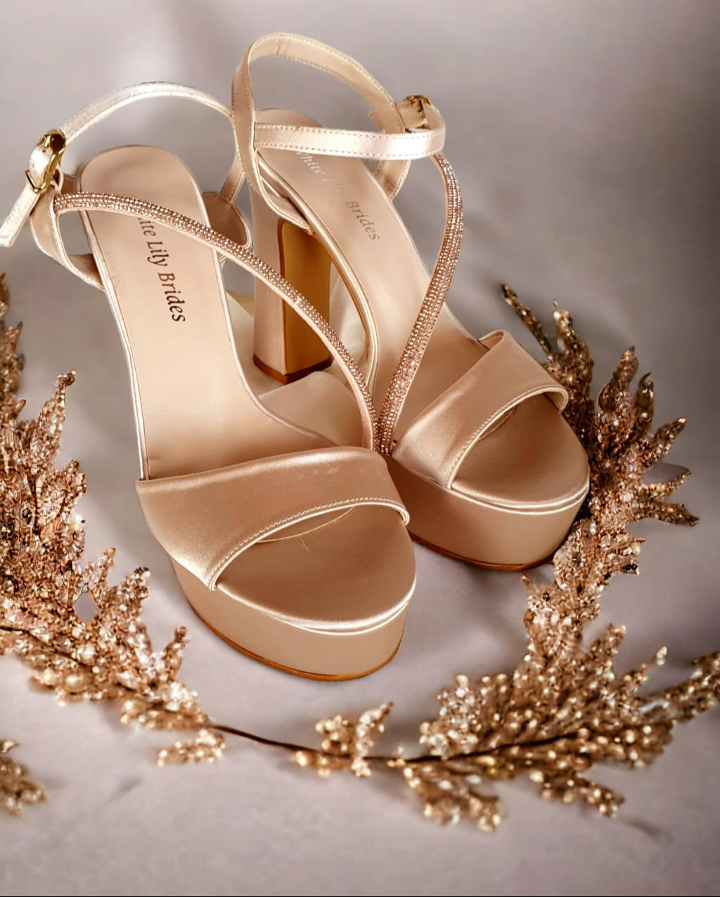 Elegant nude satin bridal sandals with a 12cm block heel and 4.5cm platform, featuring delicate rhinestone-adorned straps, designed for brides looking for both comfort and sophistication.