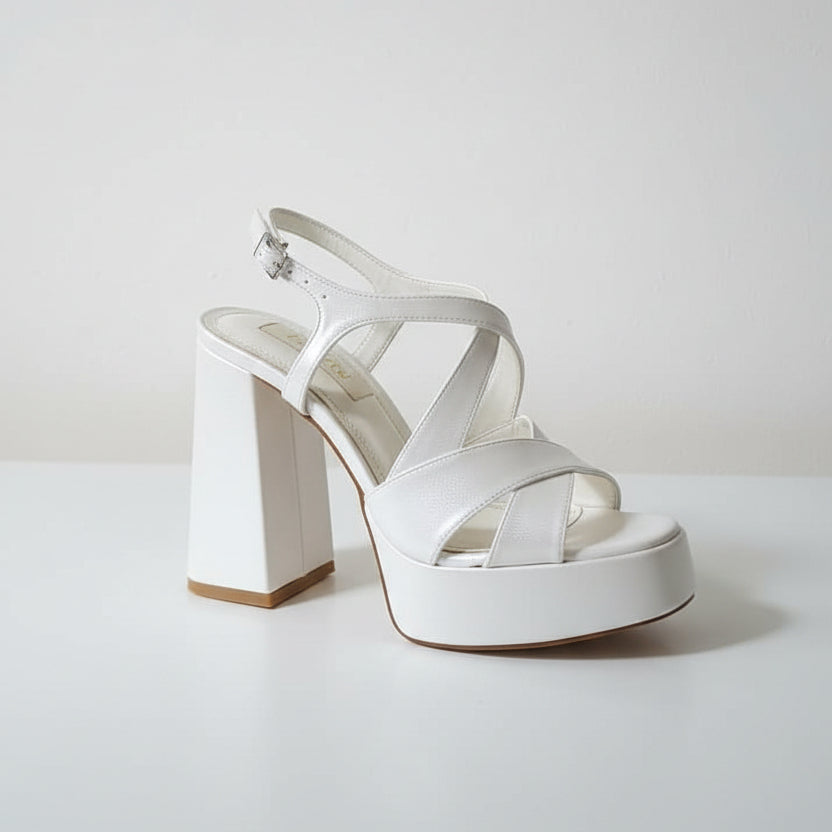 11 cm block heel white sandal on a white surface 