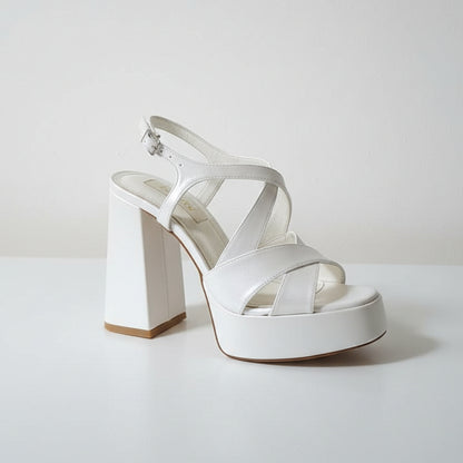 11 cm block heel white sandal on a white surface 