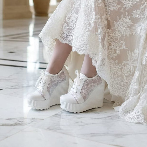 12 cm White lace wedges bridal platform sneakers Rock  on a white surface with flowers  on Beirut Lebanon