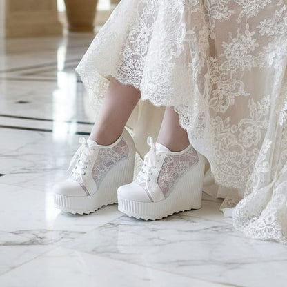 12 cm White lace wedges bridal platform sneakers Rock  on a white surface with flowers  on Beirut Lebanon