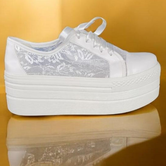 White Lace Bridal Platform Sneakers – 7cm Elevation | White Lily Brides

Step into elegance with our White Lace Bridal Platform Sneakers—the perfect blend of comfort, style, and sophistication. Designed for modern brides who want to move with ease while maintaining a luxurious touch, these sneakers are crafted with delicate lace detailing and a 7cm platform for an elevated yet effortless look.

✔ 7cm platform for subtle height and all-day comfort
✔ Timeless design—never part of an outdated collection
✔ Clas