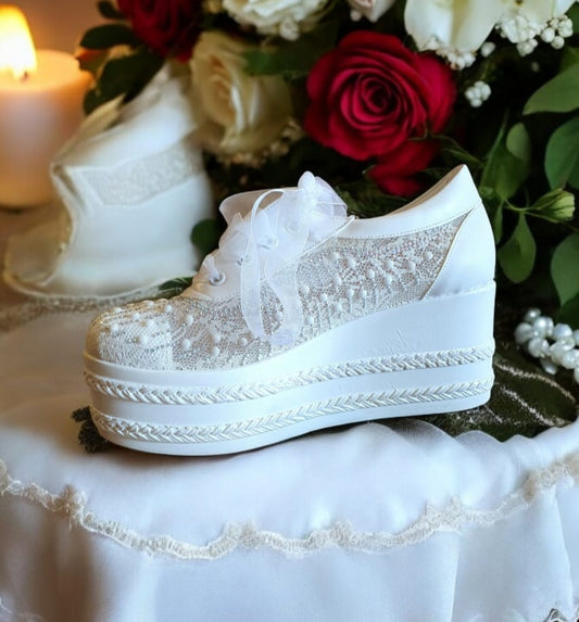 A white bridal sneaker with lace details and a platform sole, in Beirut Lebanon