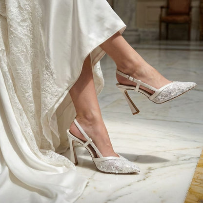 Bride wearing wedding dress and 11cm Bridal high-heeled shoes in an elegant indoor setting.