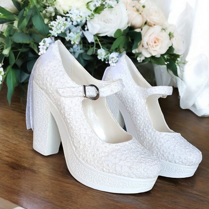 White bridal platform heels with ankle strap, block heel, and lace texture. Perfect for weddings, graduations, and baptisms in Beirut Lebanon.