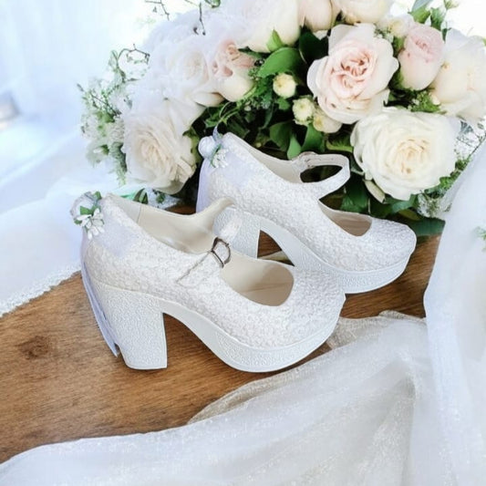 Walk down the aisle in style with these elegant lace bridal platform heels. Secure  strap, stable chunky heel, and timeless wedding elegance.