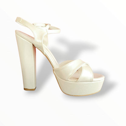 Mother of pearl high-heeled platform sandal with thick block heel, cross-over front straps, and ankle strap with buckle closure, displayed on a white background Beirut Lebanon