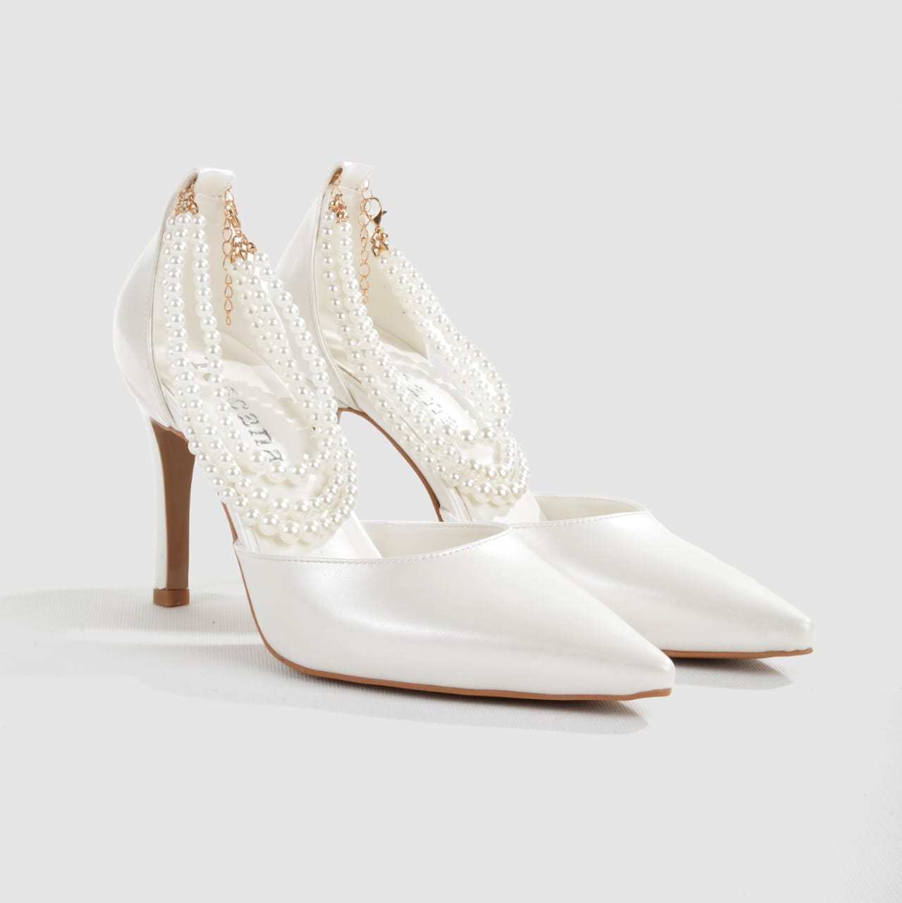 Pearl-strap bridal shoes in ivory Leather with 8cm heel by White Lily Brides.