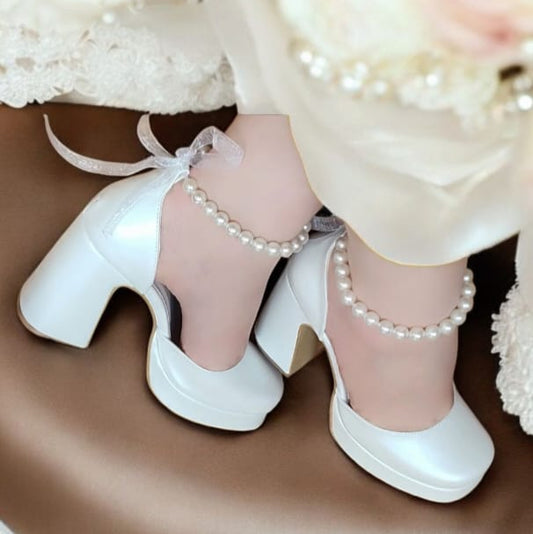 Pearl white bridal heels with comfy 9–10 cm block heel and ankle pearls, perfect for weddings, bridesmaids, graduations, and baptisms – by White Lily Brides, Beirut Lebanon.