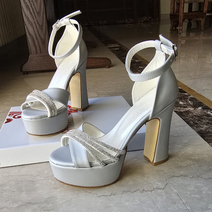 Silver color heel is crafted in satin fabric with shimmering rhinestone straps, making them ideal for weddings, bridesmaids, graduations, and special events.