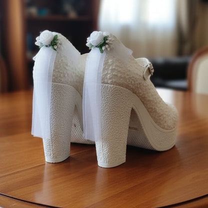 White Bridal high-heeled shoes with floral decorations