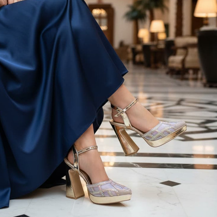 Gold high-heeled shoes with rhinestone embellishments