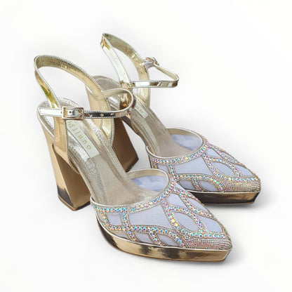 Gold high-heeled shoes with rhinestone embellishments on a white background