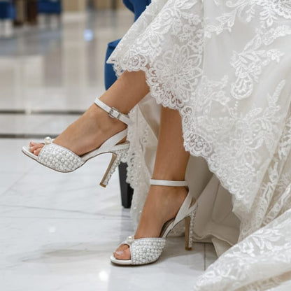 Elegant white wedding shoes with pearls and crystals, perfect for luxury bridal styling in Lebanon.