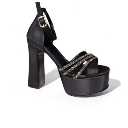 Black platform high heel shoe on a white background