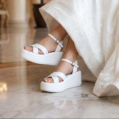 Bridal White platform sandals worn by a Bride in a formal setting.