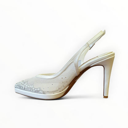 White high-heeled shoe with embellishments on a white background
