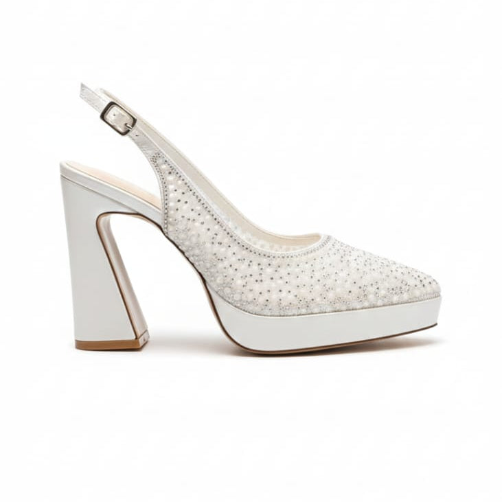 White high-heeled shoe with platform on a white background