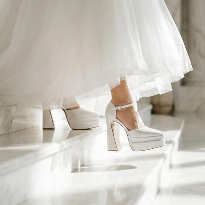 Bride wearing a wedding dress and high-heeled Wedding shoes on a marble floor in Beirut