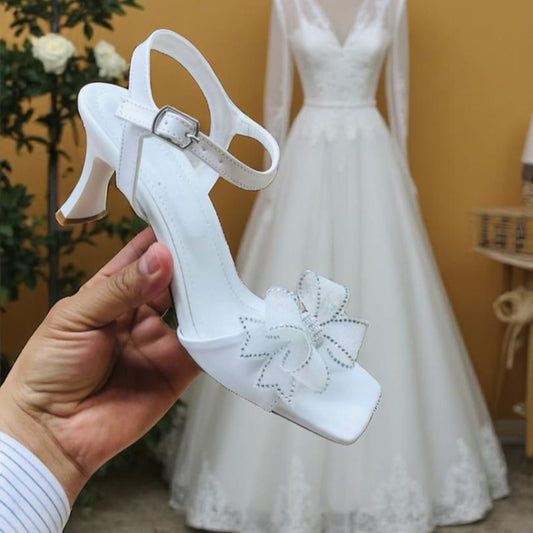 White Lily Brides 8-9 cm comfy white bridal heel sandal with ankle strap and floral bow, perfect for weddings, brides & special occasions in Beirut, Lebanon – online delivery nationwide.