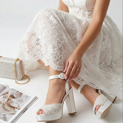 White lace dress with white high-heeled wedding shoes on a light background in Beirut
