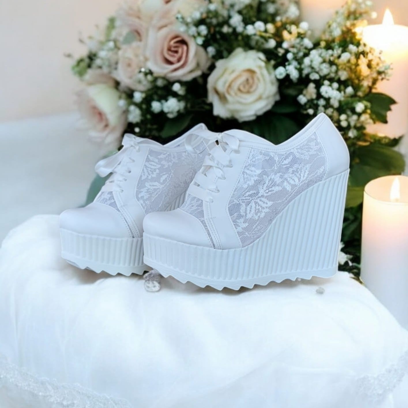 White lace wedges sneakers Rock  on a white surface with flowers 