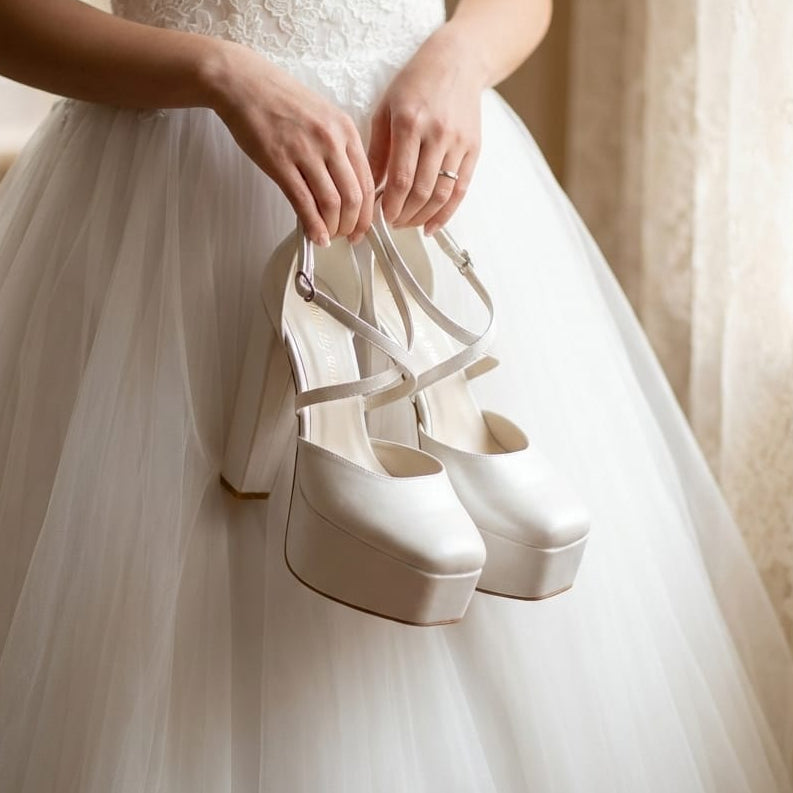  Elegant ivory leather wedding shoes with a double semelle platform and modern square toe for the stylish bride.
