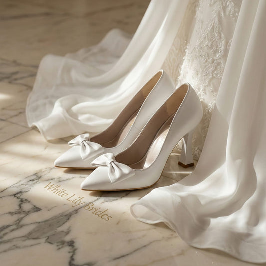 High-quality smooth white wedding heels with a sophisticated bow design, photographed in Beirut, Lebanon