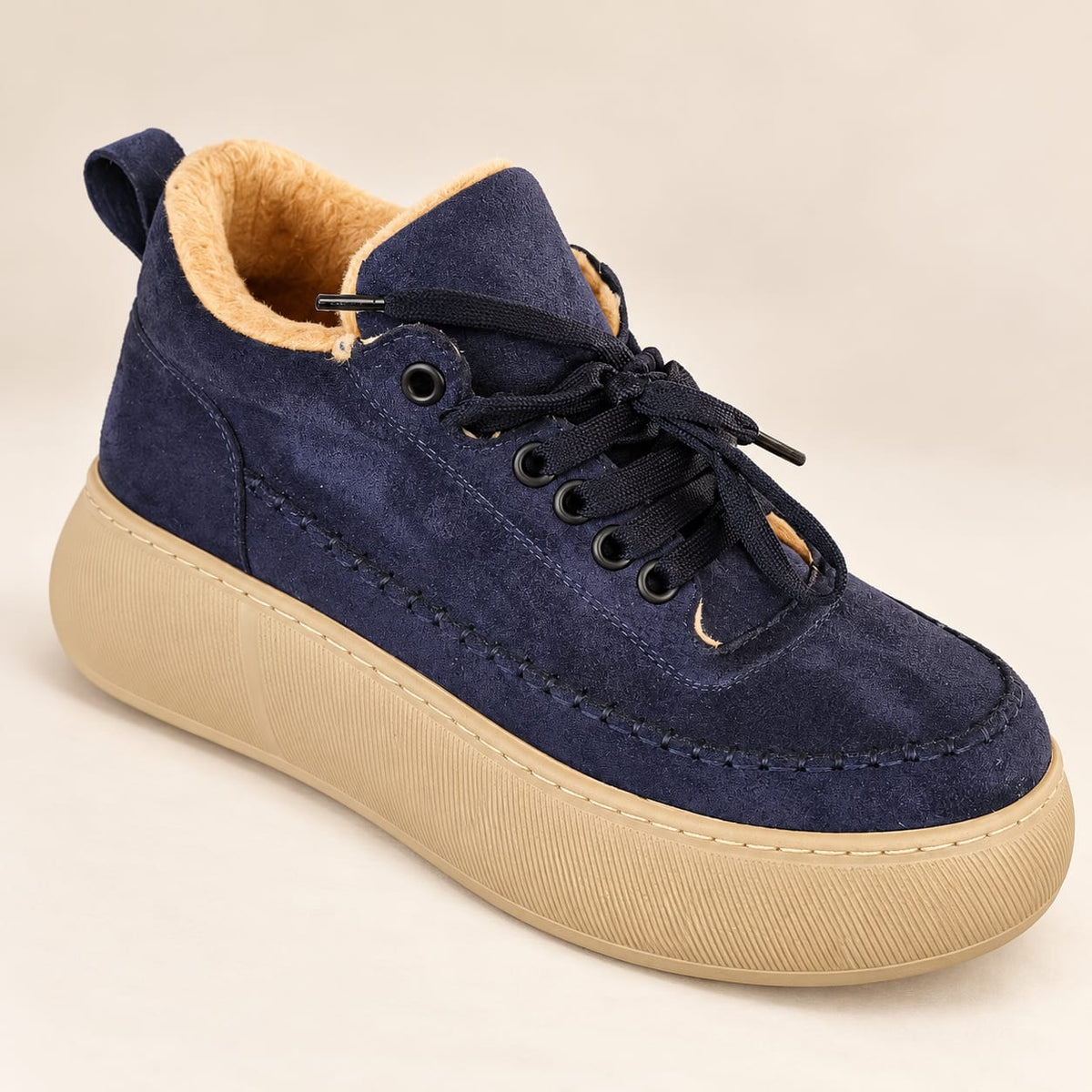 Women's navy blue suede-look platform sneakers with warm camel fur lining, navy laces, and thick beige soles – White Lily Brides.