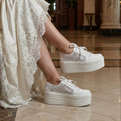White Lily Brides white lace platform wedding sneakers with ribbon laces, worn by a bride in a luxury hotel lobby in Beirut, Lebanon.
