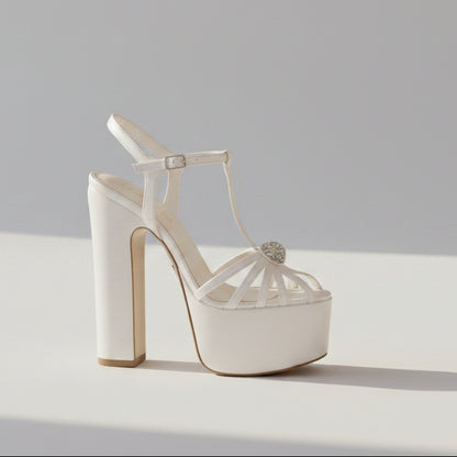 Professional studio shot of a White Lily Brides pearl white wedding white platform Sandal high heeled  shoe, 16cm high heel with 6cm platform and crystal detail, stocked in Beirut, Lebanon.