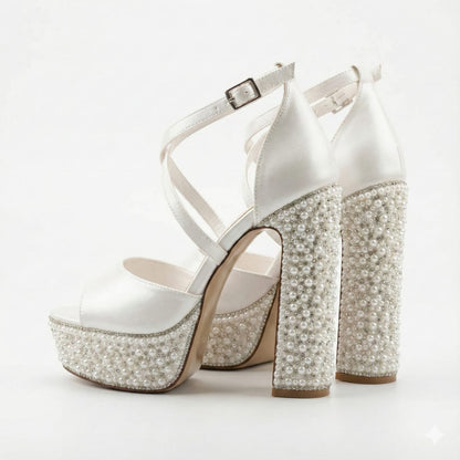 White Lily Brides platform wedding sandals with criss-cross straps and luxury pearl detailing.