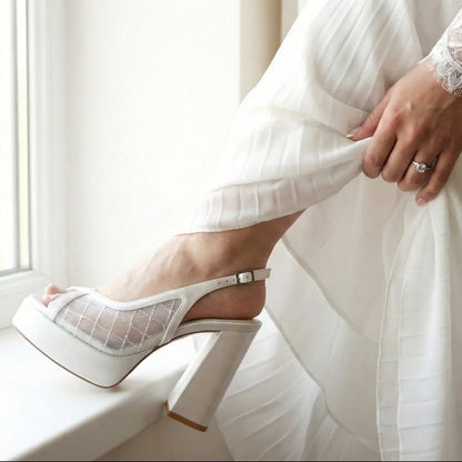 White high heel sandals featuring a satin  lace design, available in Beirut Lebanon.